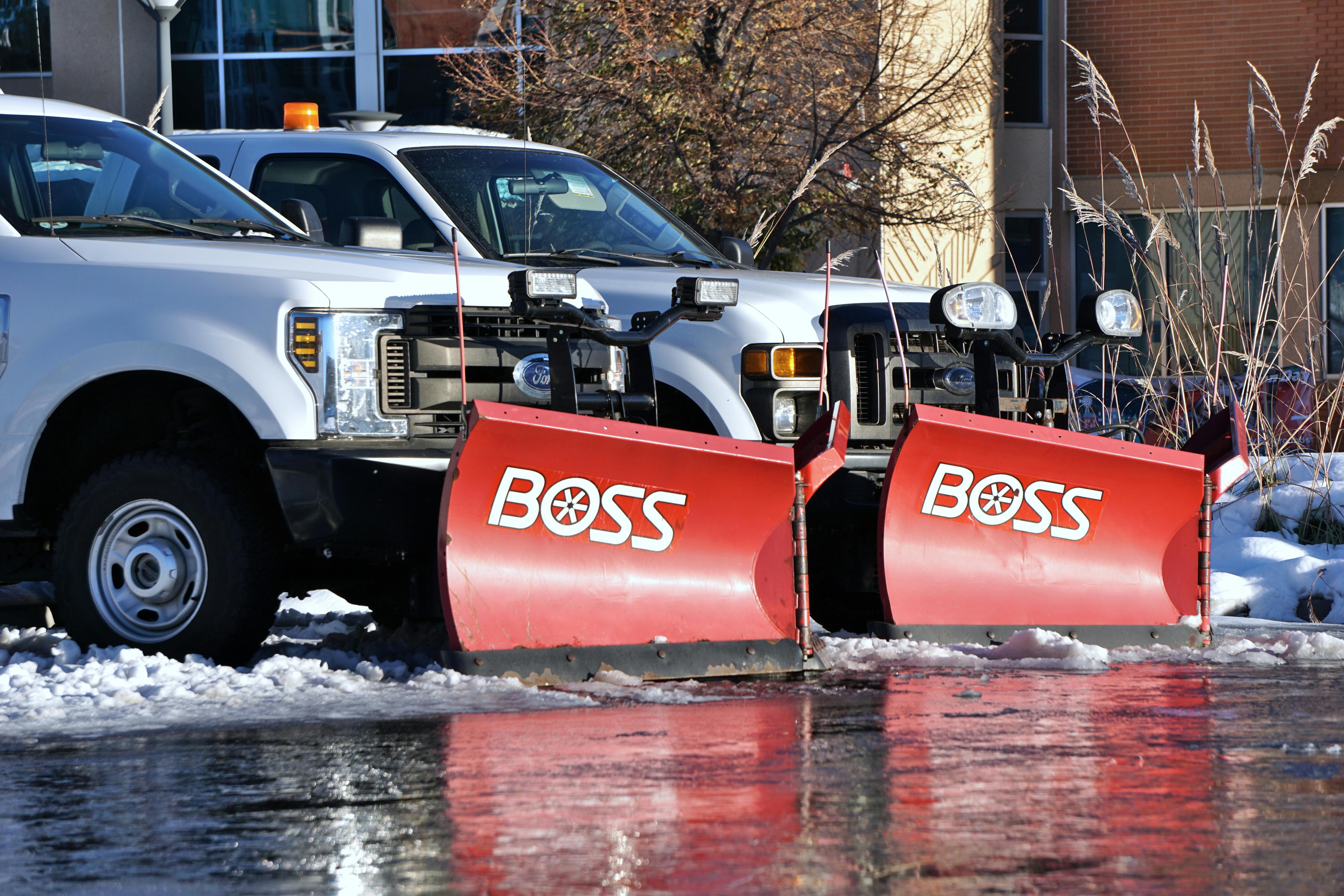 Professional snow plow trucks providing snow plowing services in Heber City